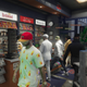 Making a pit stop at a convenience store. The player in the red hat is the founder of the AMS crew.